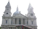 London St. Pauls Cathedral 01 Outside Full View St. Pauls Cathedral was initially built in 604AD, and was rebuilt in 675, 962 and 1087. Following the Reformation, the cathedral fell into disrepair. Inigo Jones began its restoration in 1633, adding a neo-classical portico. Sir Christopher Wren submitted a proposal for rebuilding, which the Fire of London in 1666 allowed to be realized. Wrens design received approval in 1675 with construction being finished in 1710. Here is a full view of St. Pauls Cathedral from the west, with the Bell and Lantern at the very top 111m above the church floor, and the Clock Tower to the right.